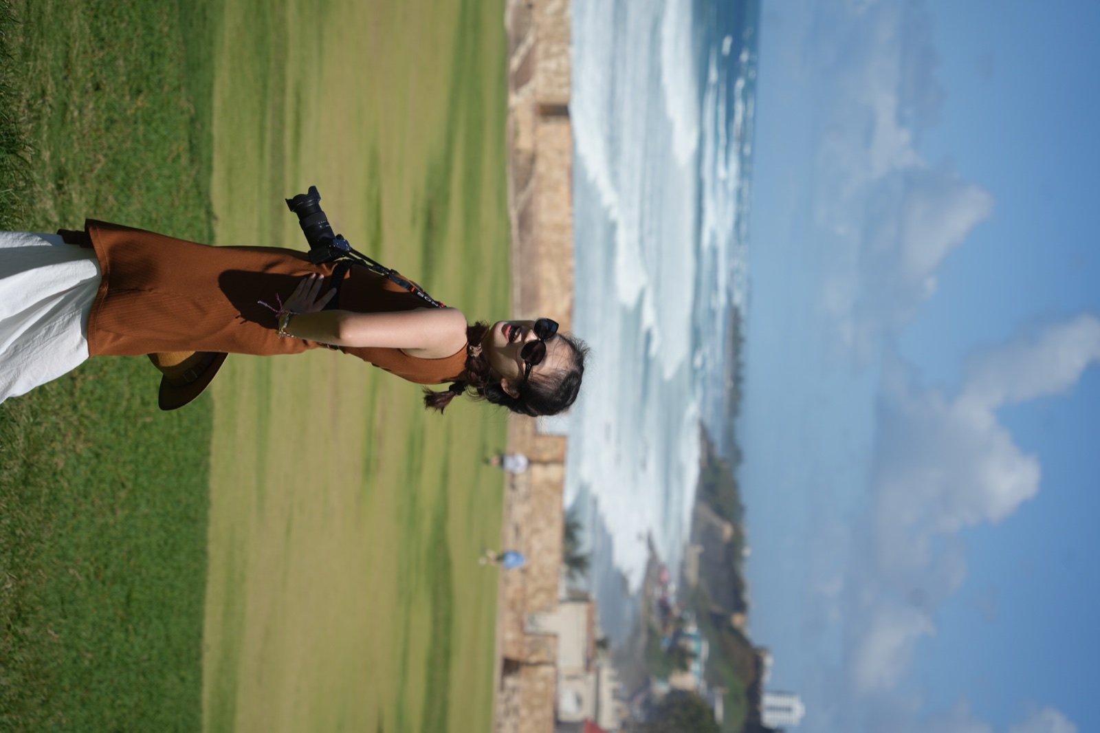 Lulu Zhao by the sea on a bright summer day
